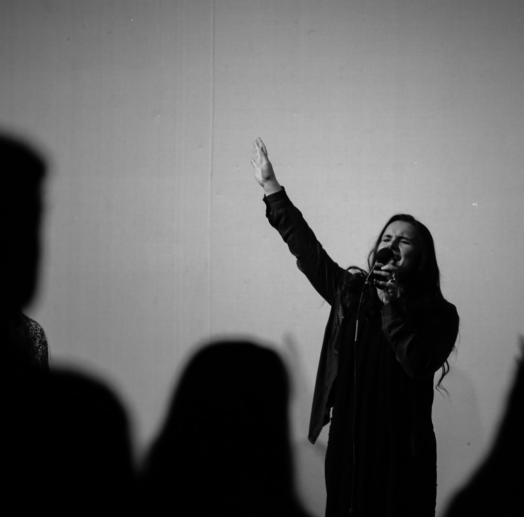 Uruguayan pop singer performing on stage under bright spotlights