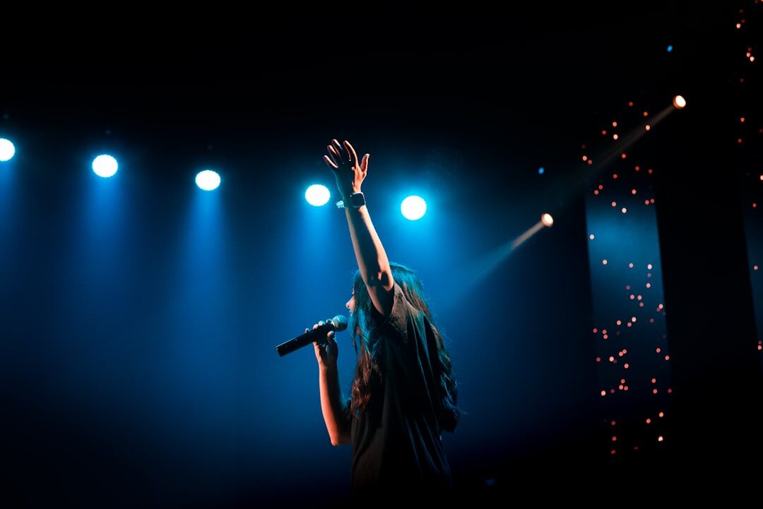 woman on stage singing