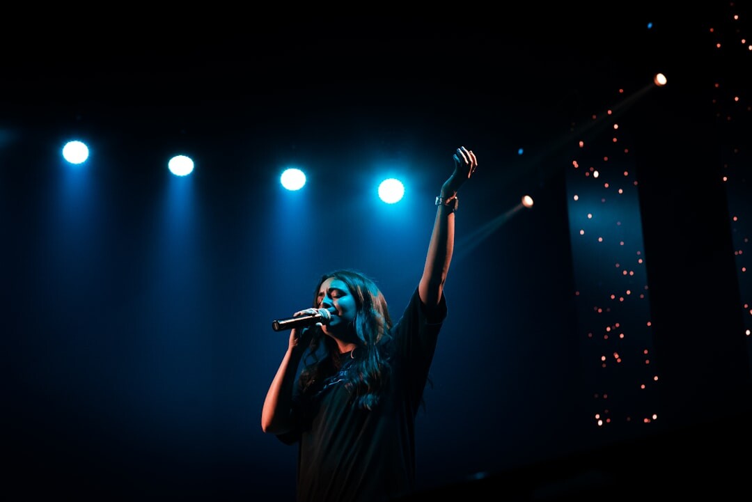woman on stage singing