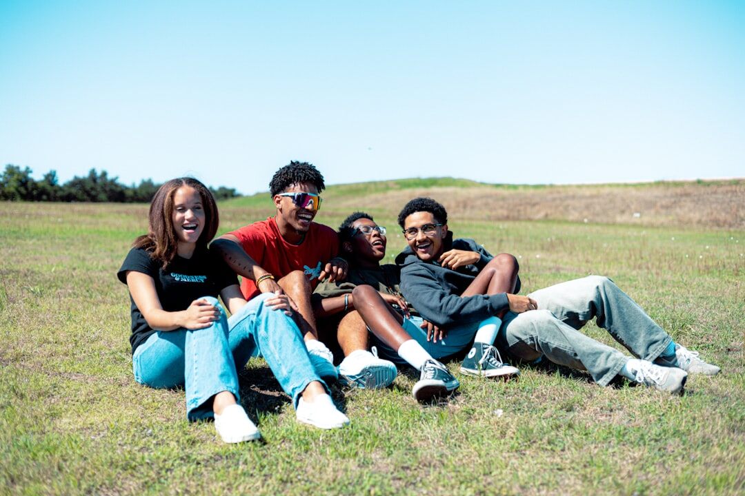 group of teens listening to music